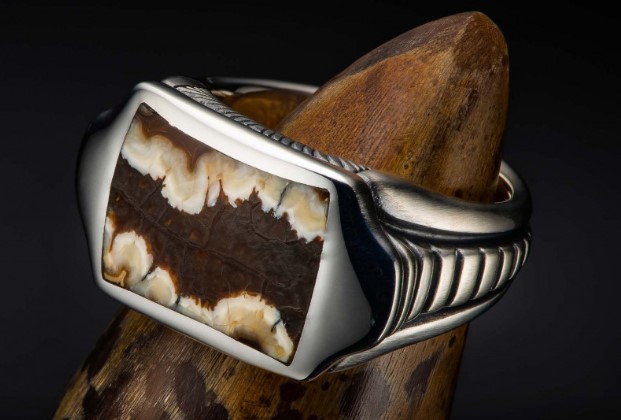 William Henry Sleek ring Having a rectangular cut Mammoth Tooth  bezel set in the center with grooved shank  size 10